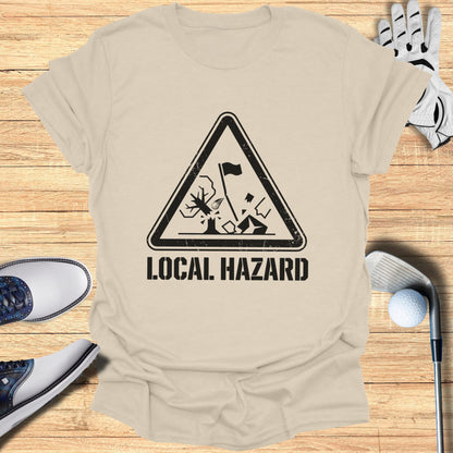 T-shirt with a black triangle hazard symbol depicting a golf hazard.