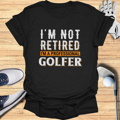 Black t-shirt with "I'm Not Retired I'm A Professional Golfer" text.