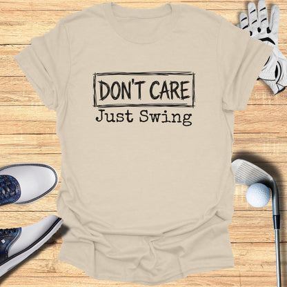 Beige t-shirt with "DON'T CARE Just Swing" text, golf clubs, shoes, and glove.