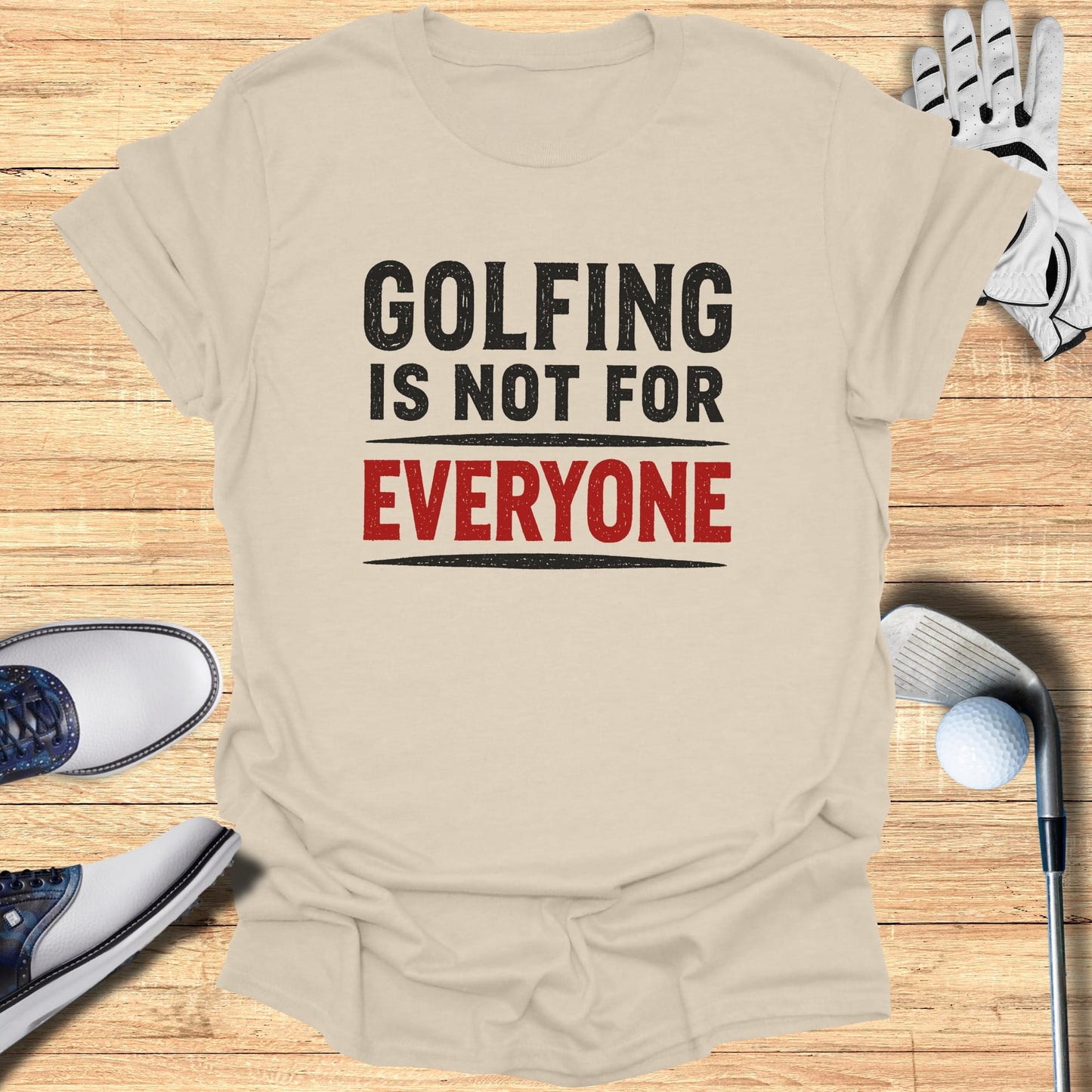 Cream t-shirt with black and red text "GOLFING IS NOT FOR EVERYONE".