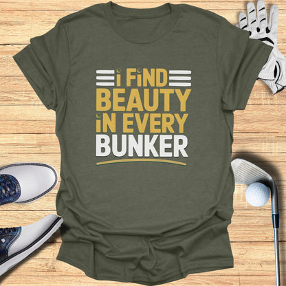 Olive green t-shirt with "I FIND BEAUTY IN EVERY BUNKER" text in yellow and white.