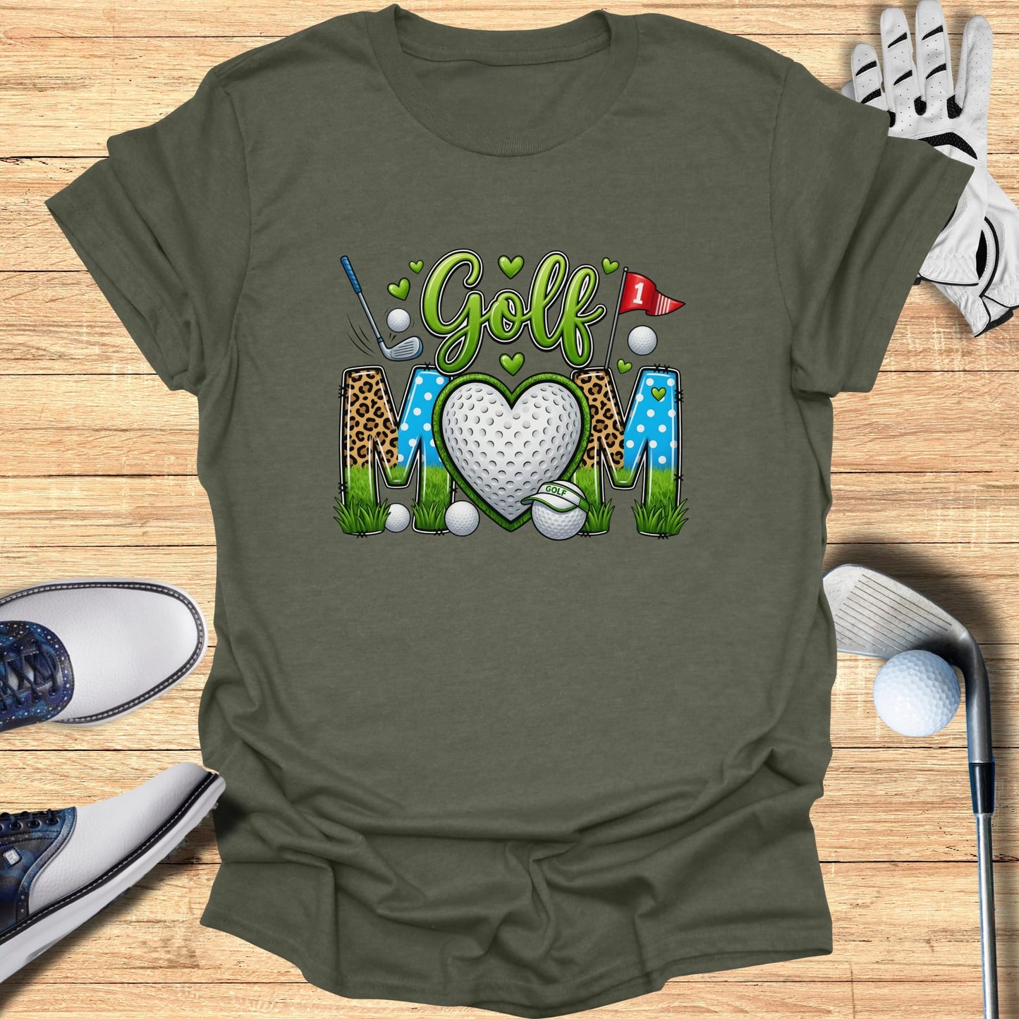 Green t-shirt with "Golf Mom" text, heart-shaped golf ball, and clubs.