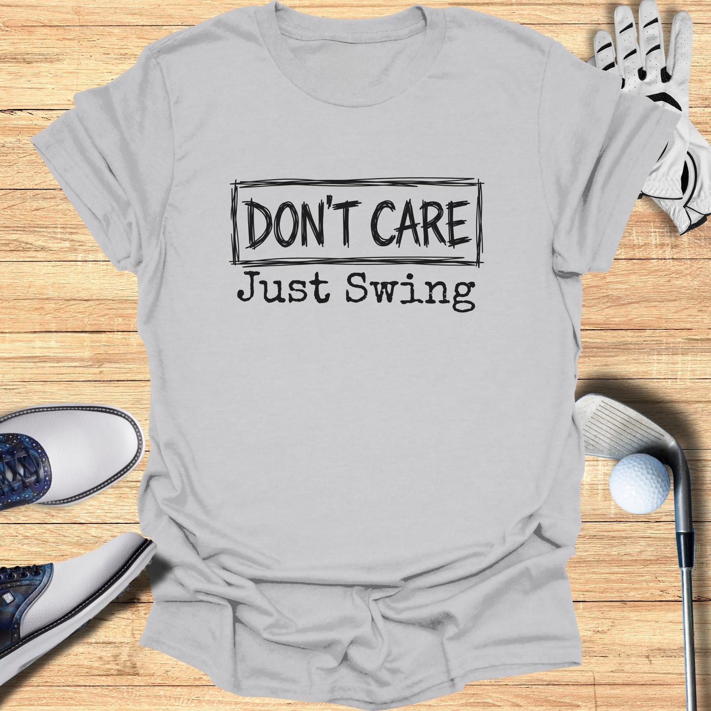 Gray t-shirt with "DON'T CARE Just Swing" text.