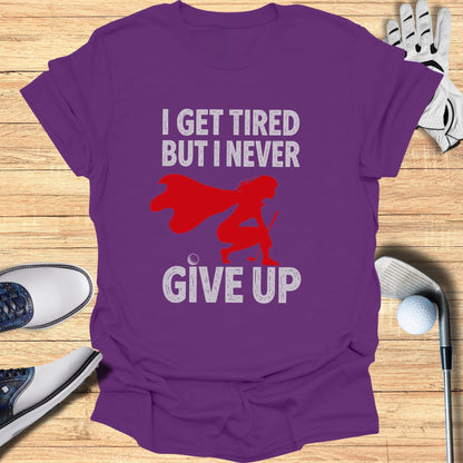 Purple t-shirt with "I GET TIRED BUT I NEVER GIVE UP" graphic.
