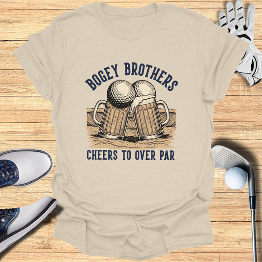 Beer mugs and golf balls graphic on tan t-shirt with text "Bogey Brothers Cheers To Over Par".