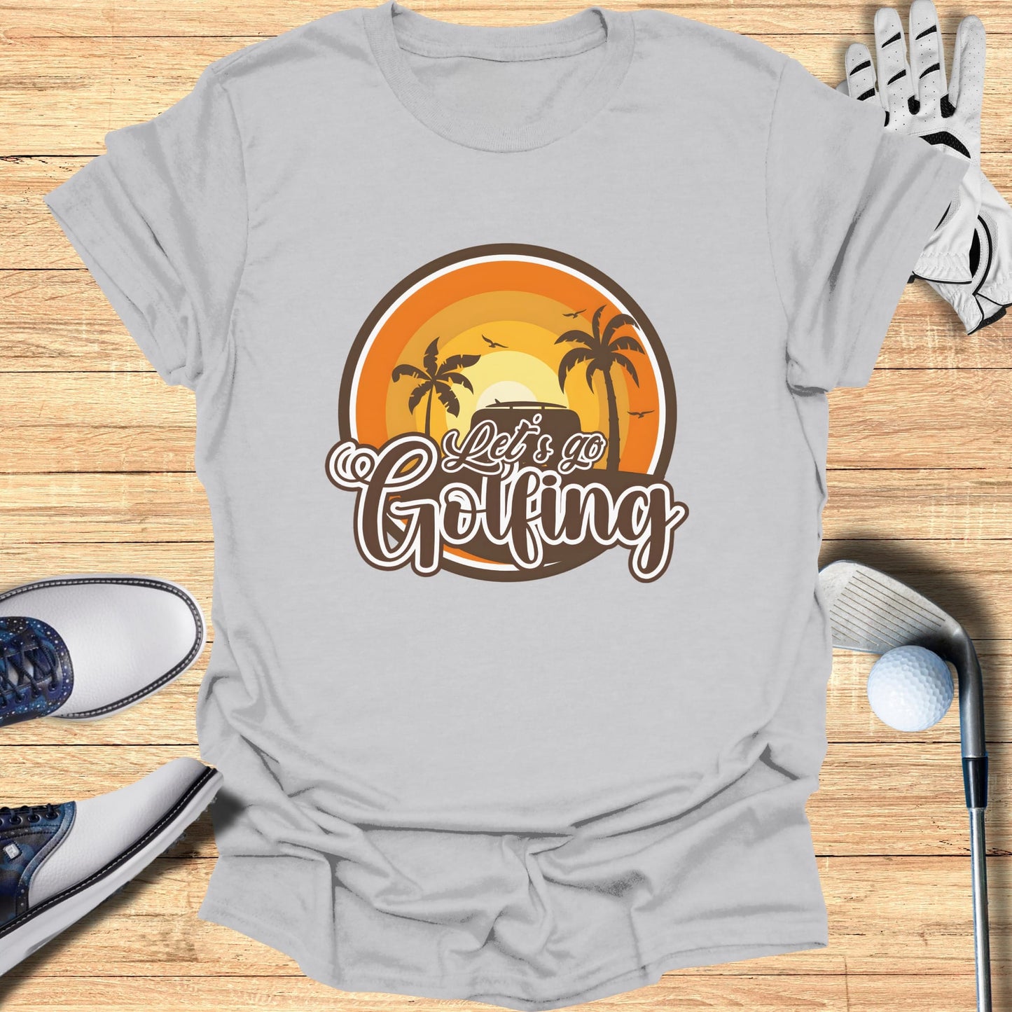 T-shirt with "Let's Go Golfing" text and sunset graphic.