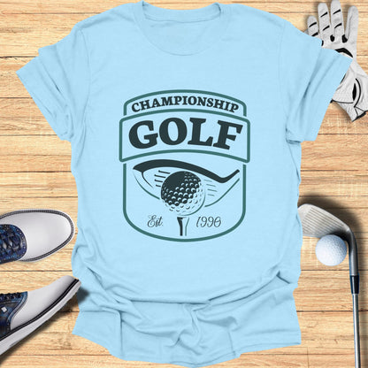 Light blue t-shirt with "Championship Golf Est. 1996" logo.