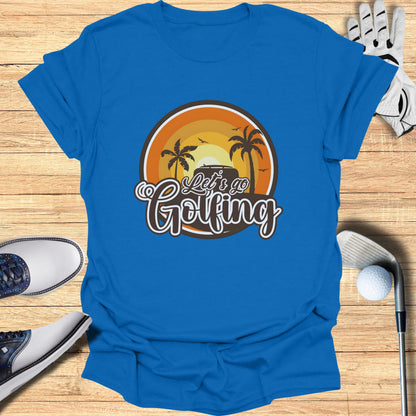 Blue t-shirt with "Let's Go Golfing" text and a sunset golf scene graphic.