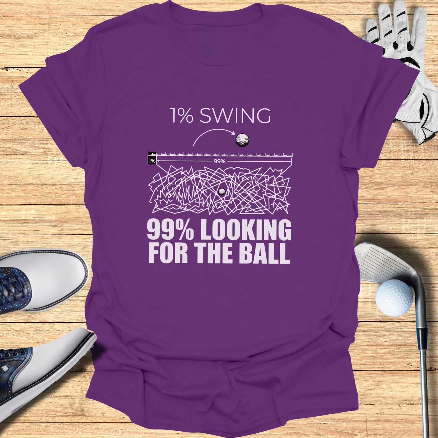 Purple t-shirt with "1% SWING 99% LOOKING FOR THE BALL" text.
