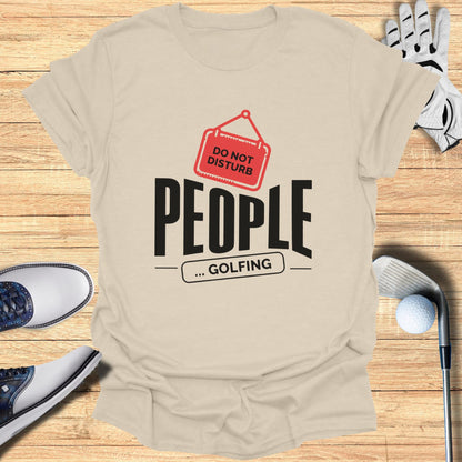 T-shirt with "PEOPLE ... GOLFING" and a "Do Not Disturb" sign.