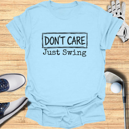Light blue t-shirt with "DON'T CARE Just Swing" text.