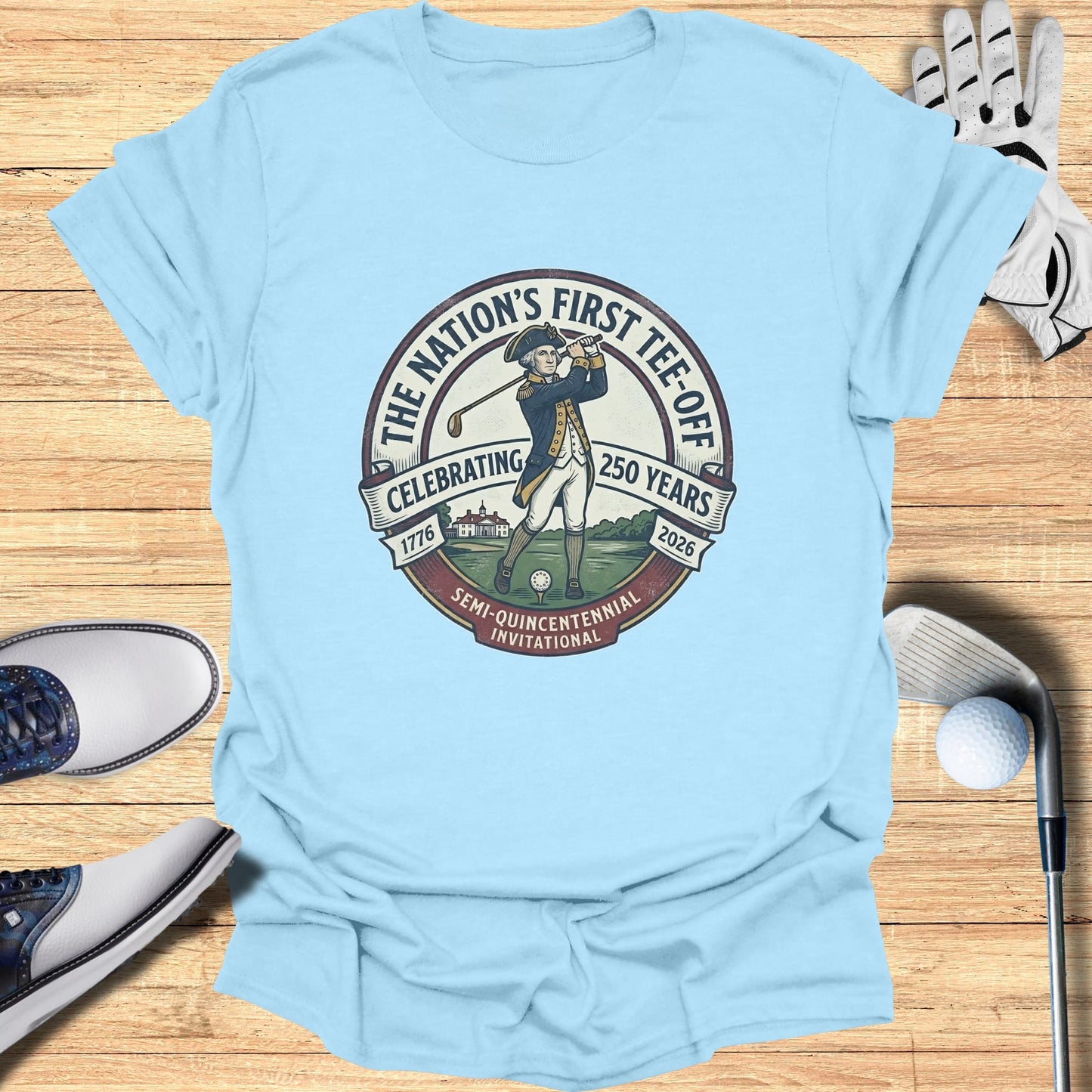 Light blue t-shirt with circular design celebrating the nation's first tee-off.