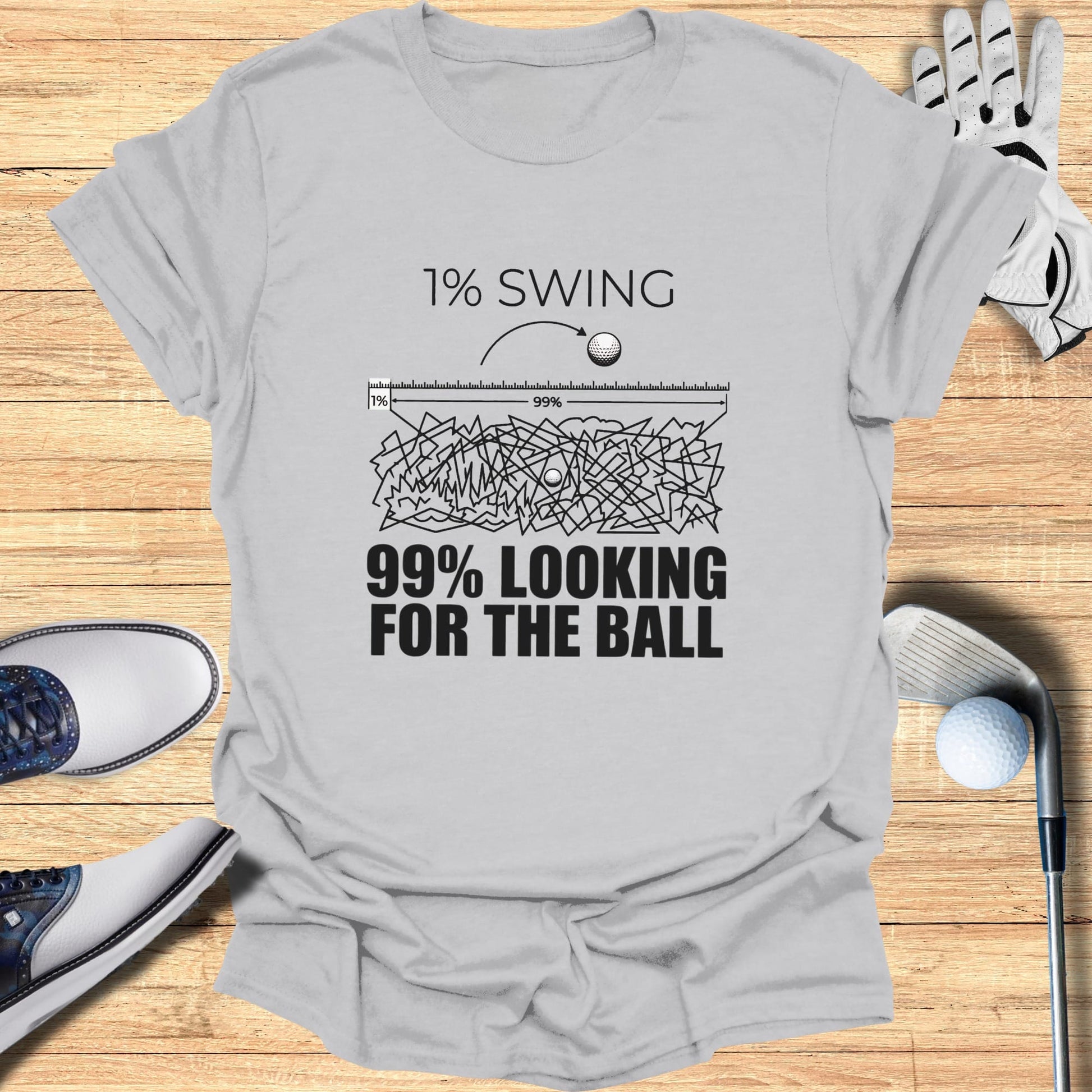 T-shirt with "1% SWING 99% LOOKING FOR THE BALL" text.