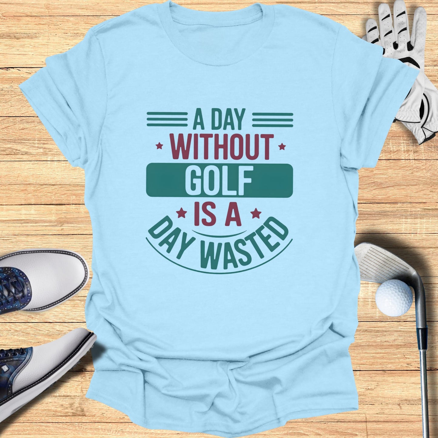 Light blue t-shirt with "A Day Without Golf Is A Day Wasted" text.
