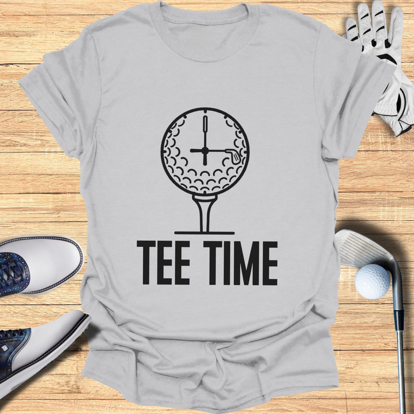 Tee Time text on a t-shirt with a golf ball and clock design.