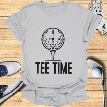 Tee Time text on a t-shirt with a golf ball and clock design.