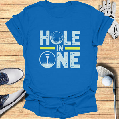 Blue t-shirt with "HOLE IN ONE" text and golf ball graphic.