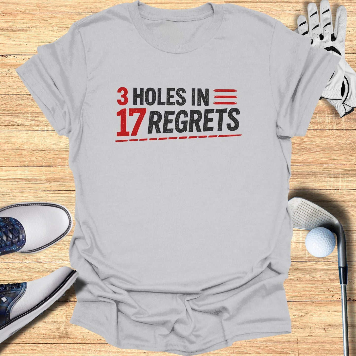 Gray t-shirt with "3 HOLES IN 17 REGRETS" in red and black text.