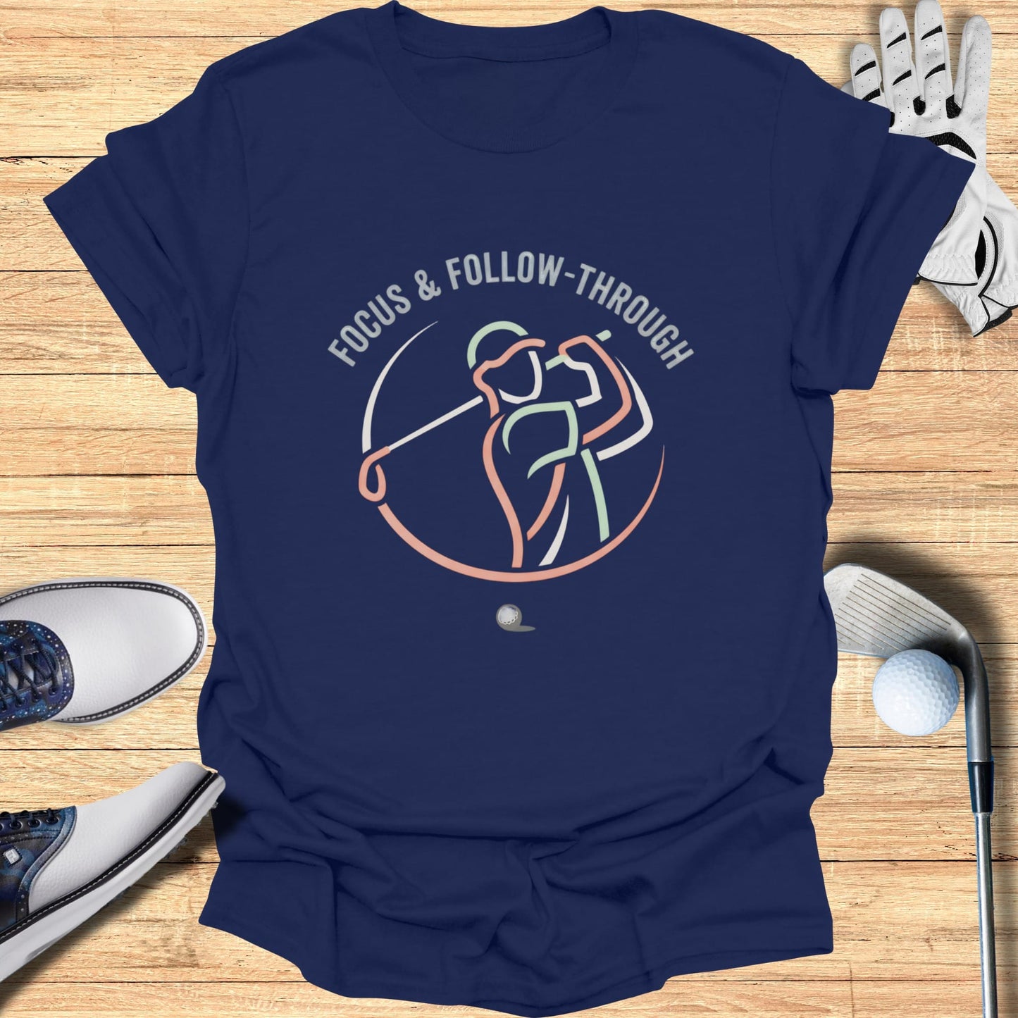Navy t-shirt with "FOCUS & FOLLOW-THROUGH" text and a golfer illustration.