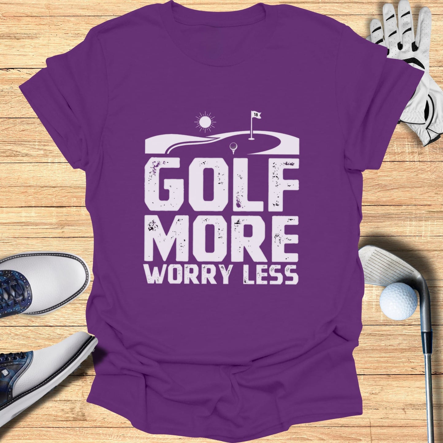 Purple t-shirt with "GOLF MORE WORRY LESS" text and golf scene graphic.