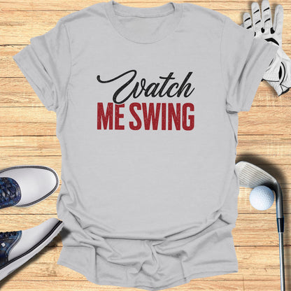 Gray t-shirt with "Watch ME SWING" in red and black text.