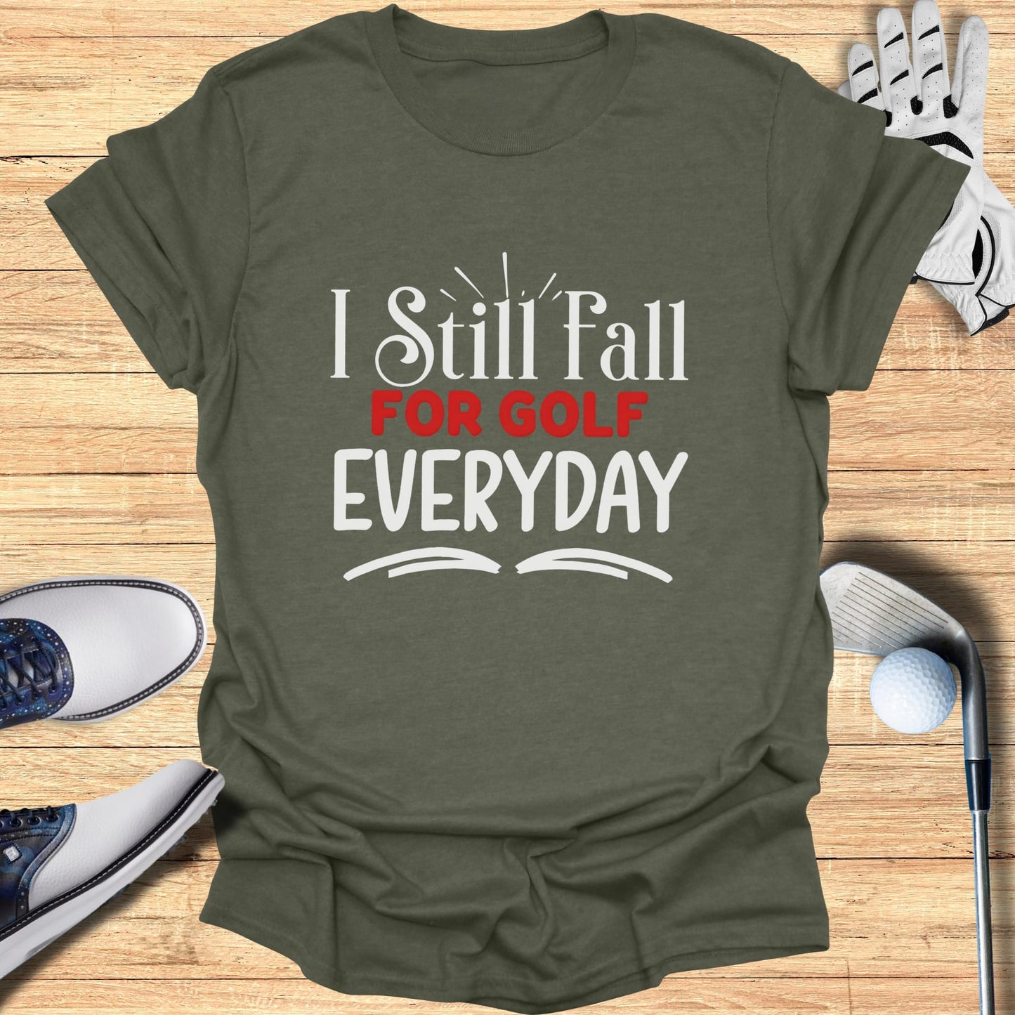 Olive green t-shirt with white text "I Still Fall for Golf Everyday."