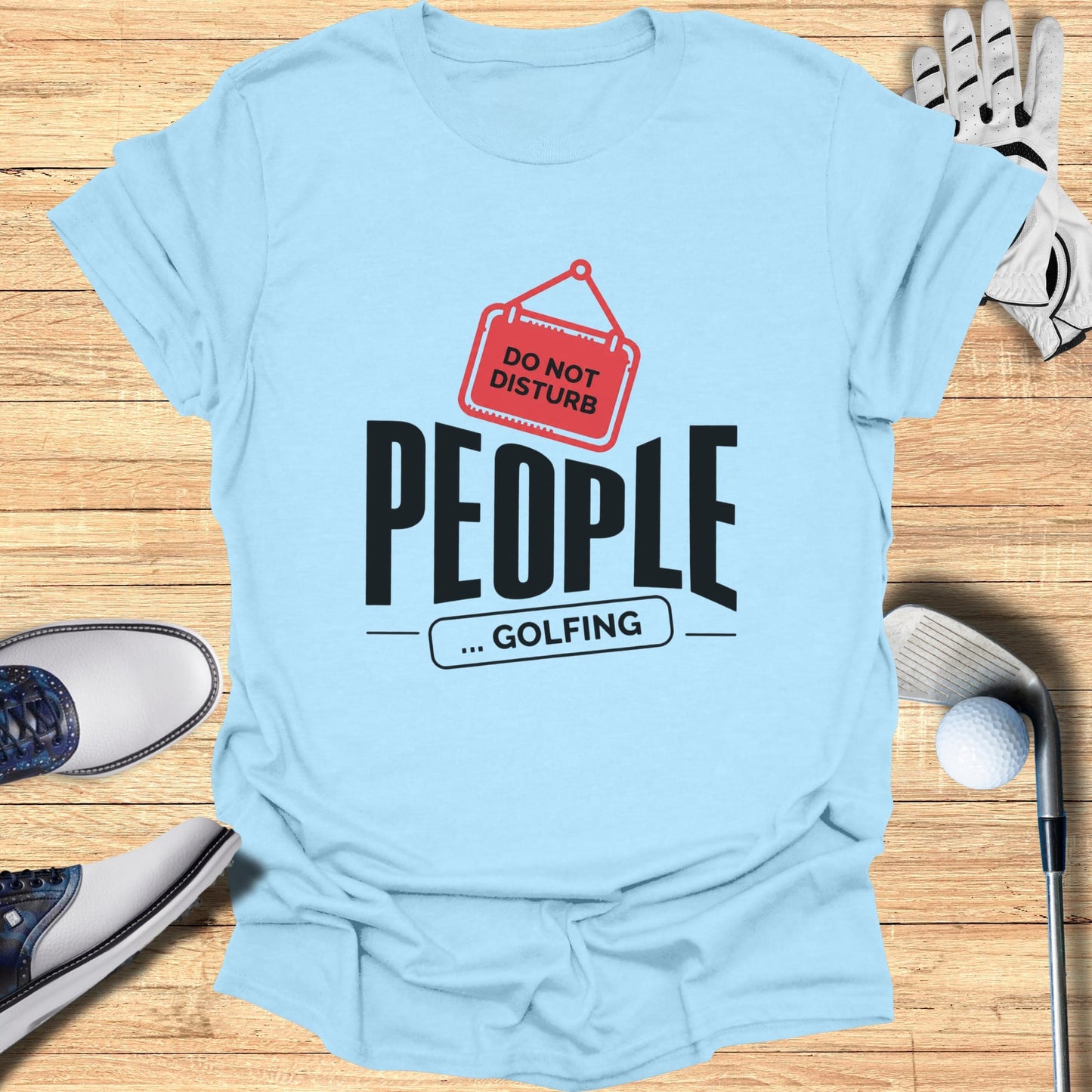 Light blue t-shirt with "DO NOT DISTURB ... GOLFING" text graphic.