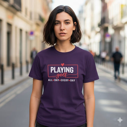 Woman wearing a purple t-shirt with "Playing Golf" and "All Day, Every Day" text.