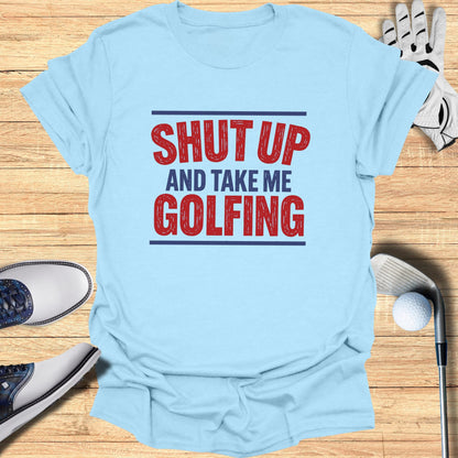 Light blue t-shirt with red text "Shut Up and Take Me Golfing."