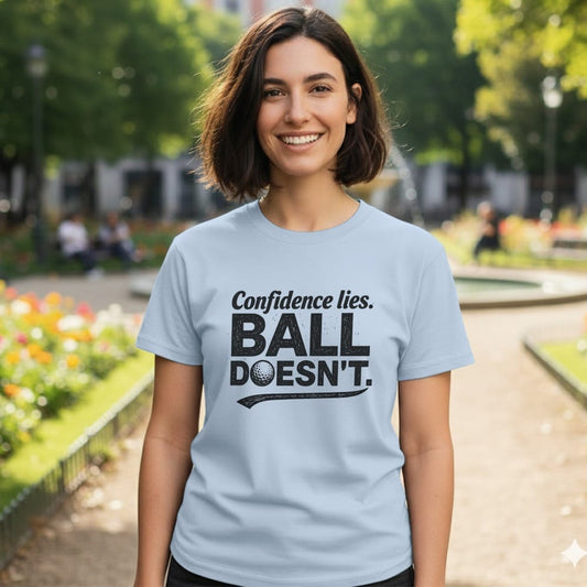 Light blue t-shirt with "Confidence lies. BALL DOESN'T." text and golf ball graphic.