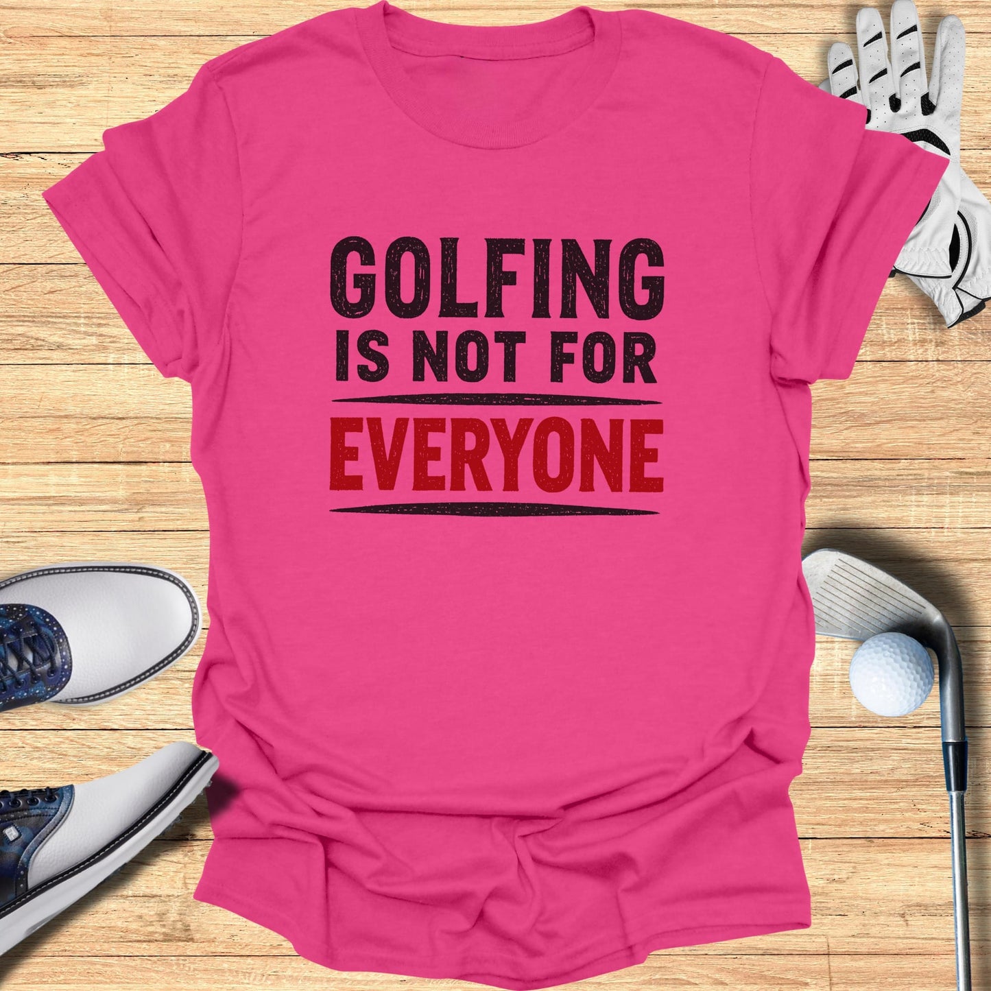 Pink t-shirt with black text "GOLFING IS NOT FOR EVERYONE" and red text "EVERYONE".