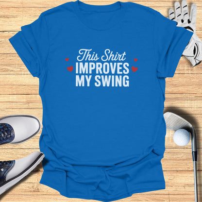 Blue t-shirt with "This Shirt Improves My Swing" text and small red hearts.