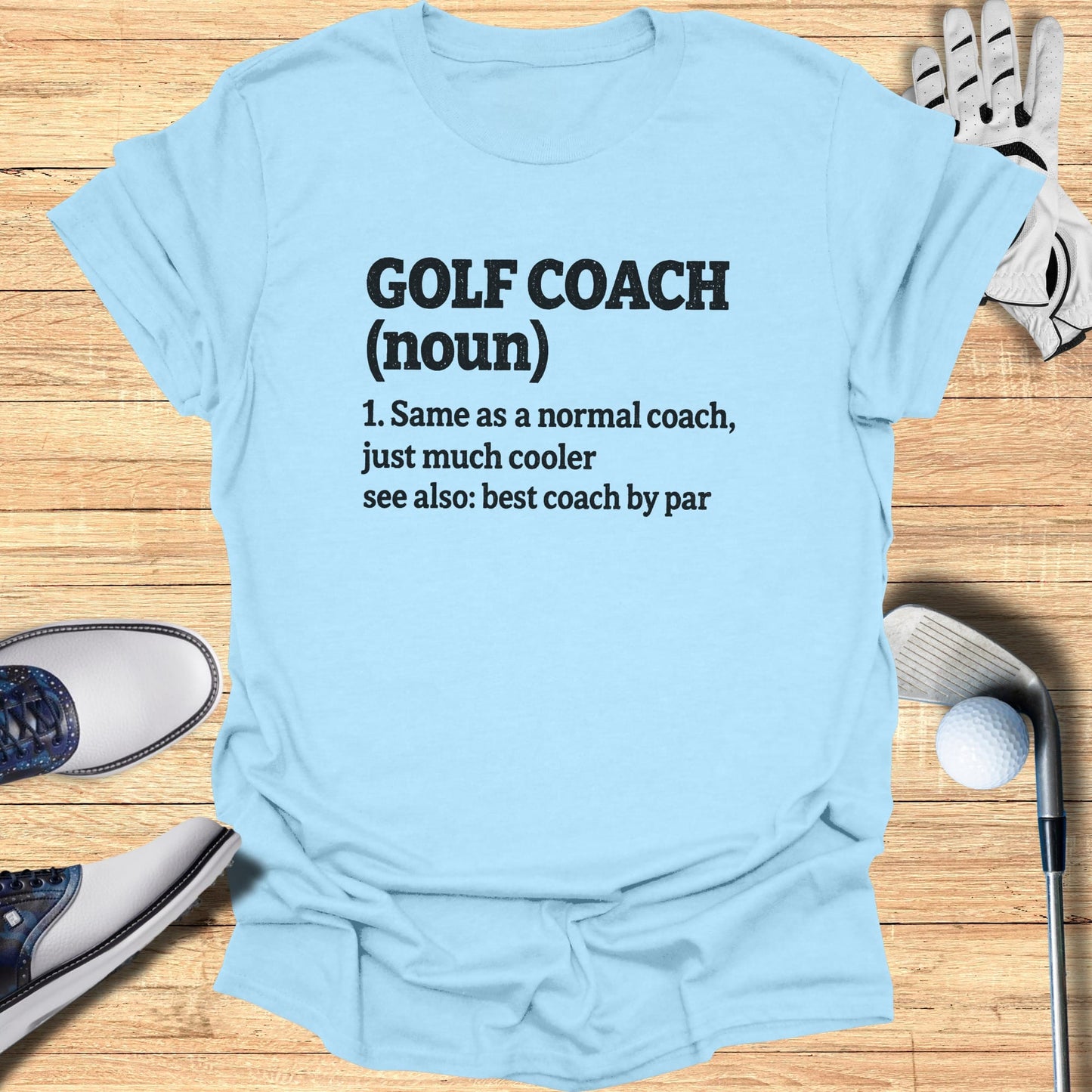 Light blue t-shirt with "Golf Coach (noun)... cooler" text.