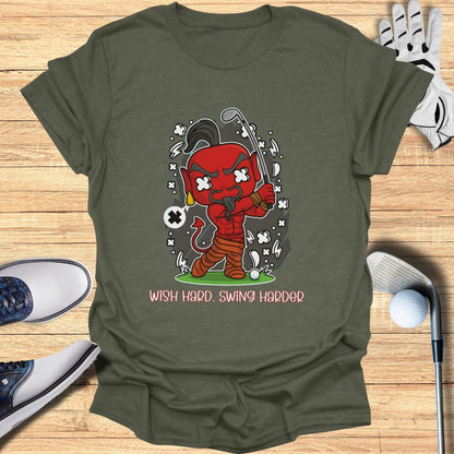 Cartoon devil character with golf club and text "Wish Hard. Swing Harder."