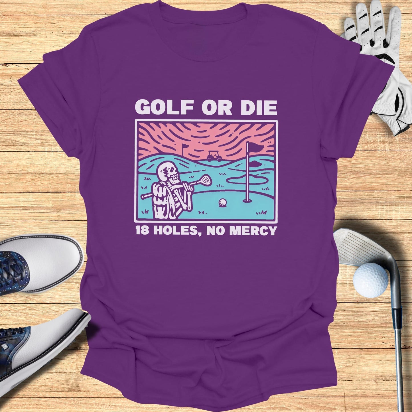 Purple t-shirt with skeleton golfer graphic and "Golf or Die 18 Holes, No Mercy" text.