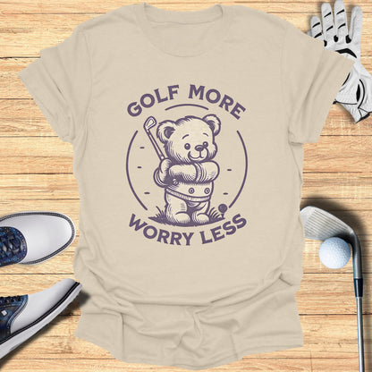 T-shirt graphic with a cartoon bear holding a golf club and wearing golf attire.