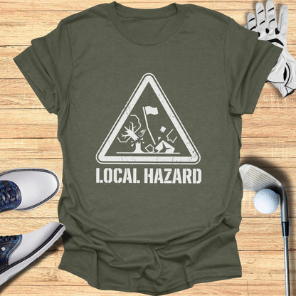 Green t-shirt with "LOCAL HAZARD" text and golf hazard graphic.