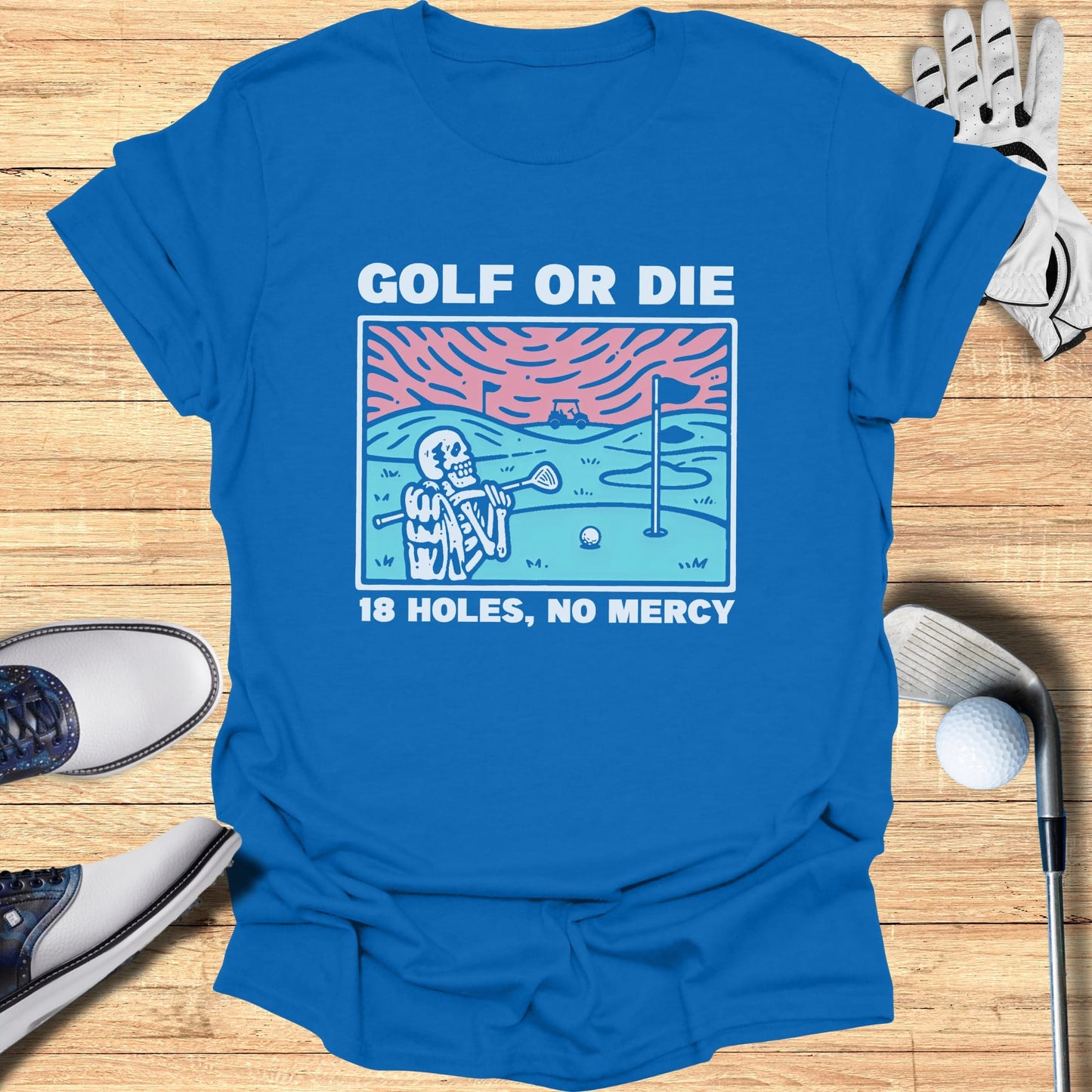 Blue t-shirt with skeleton golfer graphic and text "GOLF OR DIE 18 HOLES, NO MERCY".
