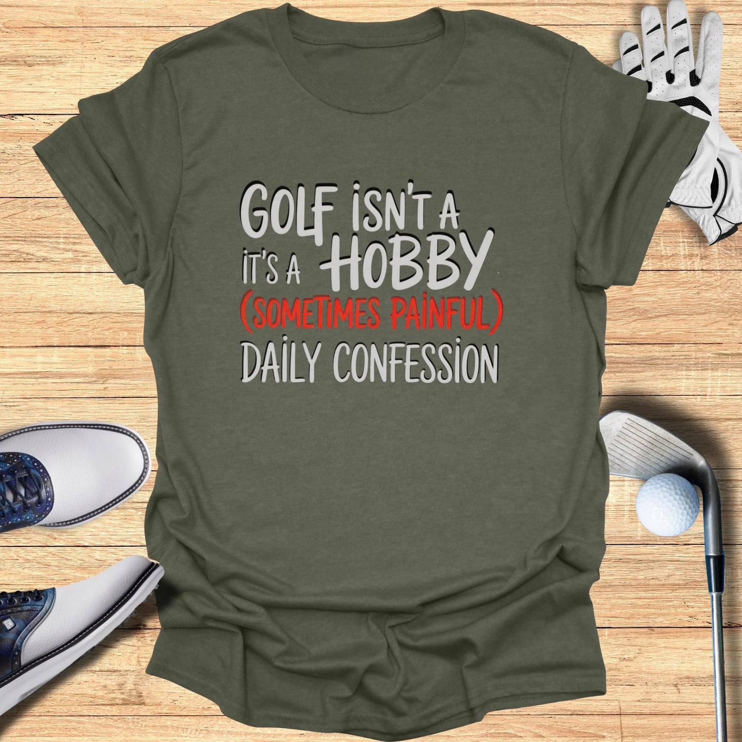 Olive green t-shirt with "Golf isn't a hobby, it's a daily confession" text.
