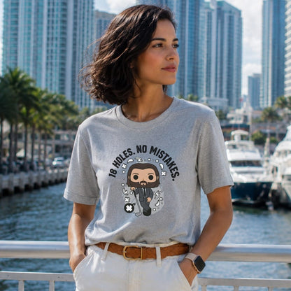 Grey t-shirt with "18 HOLES. NO MISTAKES." and cartoon golfer.