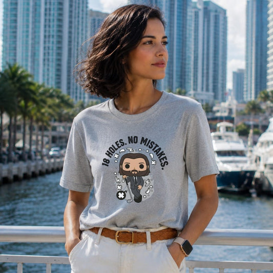 Grey t-shirt with "18 HOLES. NO MISTAKES." and cartoon golfer.