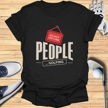 Black t-shirt with "DO NOT DISTURB PEOPLE ... GOLFING" text and golf accessories.