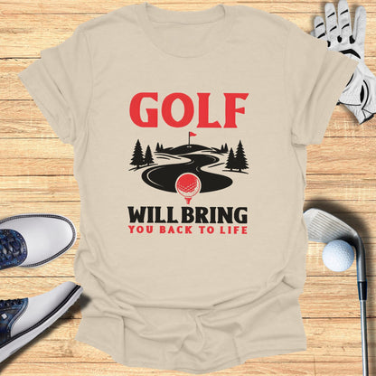 Light beige t-shirt with "Golf Will Bring You Back to Life" text and golf imagery.