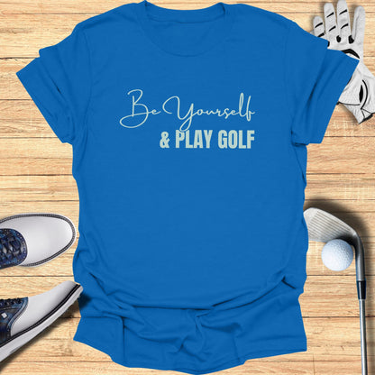 Blue t-shirt with "Be Yourself & Play GOLF" text and golf accessories.