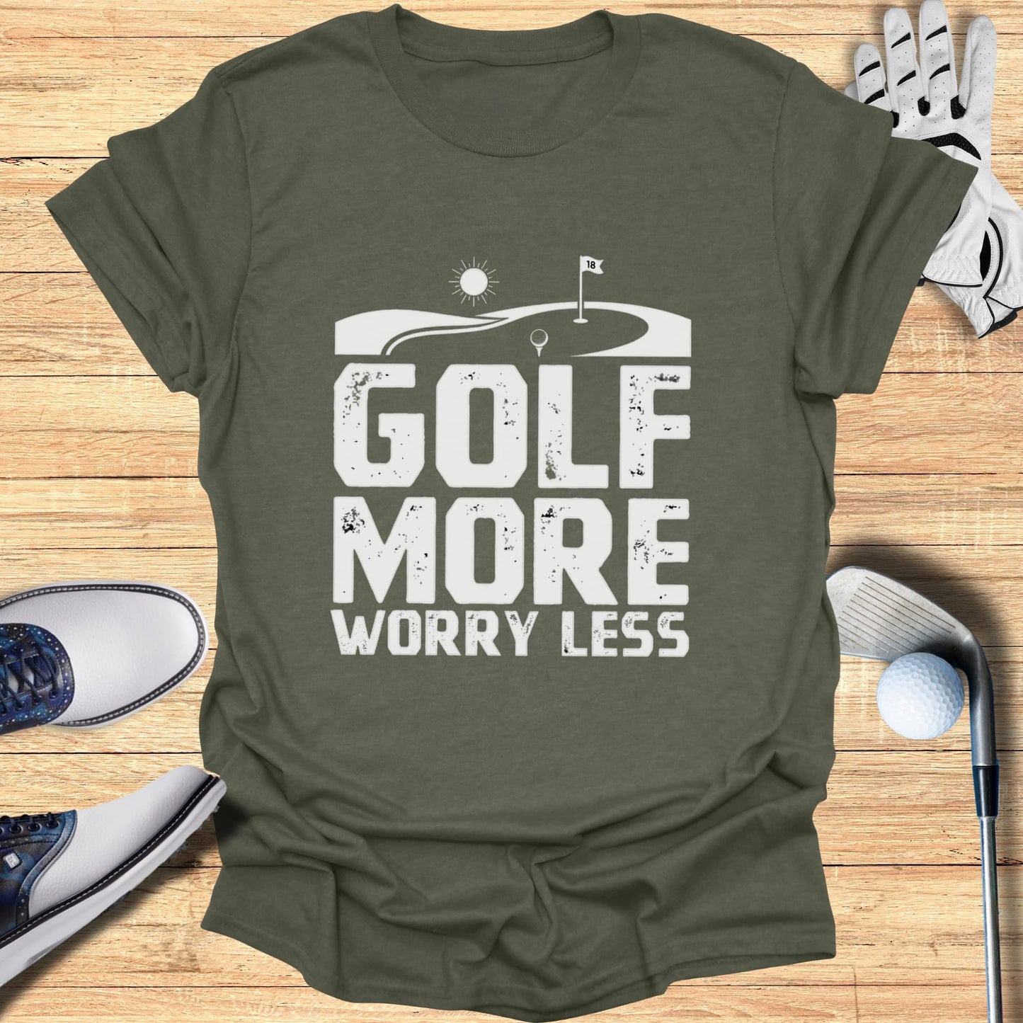 T-shirt with "Golf More Worry Less" text and golf imagery.