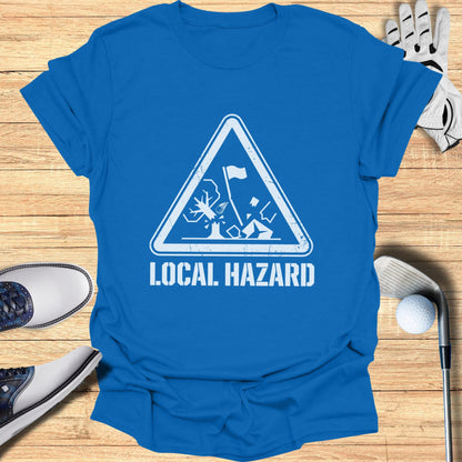 Blue t-shirt with white triangle graphic reading "LOCAL HAZARD" and golf imagery.