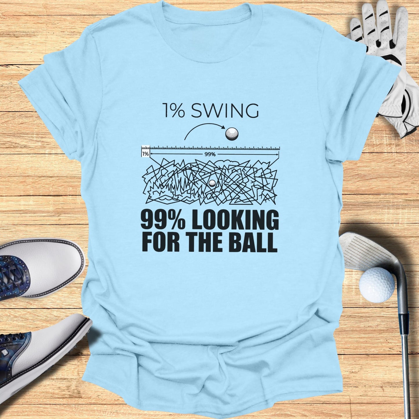 Light blue t-shirt with "1% SWING 99% LOOKING FOR THE BALL" text.
