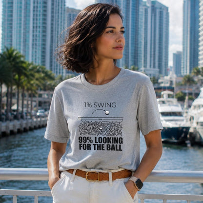 Grey t-shirt with "1% SWING 99% LOOKING FOR THE BALL" text and golf ball graphic.