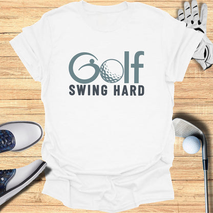 White t-shirt with "Golf Swing Hard" text and golf accessories.