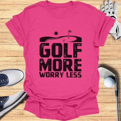Pink t-shirt with "GOLF MORE WORRY LESS" graphic and golf imagery.